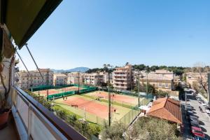 a tennis court in a city with buildings at Frezia Apartment in Corfu
