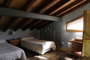 Säng eller sängar i ett rum på Las cabañas de valsain