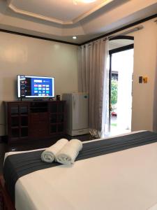 Postel nebo postele na pokoji v ubytování Ettamogah Hotel Inc.