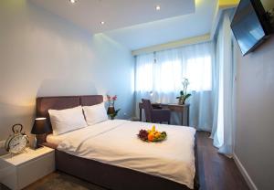 Posteľ alebo postele v izbe v ubytovaní Oxygen Residence