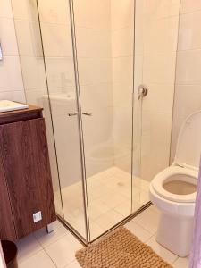 a bathroom with a shower and a toilet at Apartamento zona colonial lindísimo 101 in Zipaquirá +39 photos