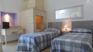 Postel nebo postele na pokoji v ubytování Antico Casale B&B