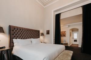 Postel nebo postele na pokoji v ubytování Hotel Manos Premier