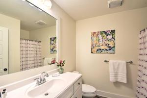 a bathroom with a sink and a mirror at 1 Mi to Town Chalet-Style Highlands Retreat in Highlands +46 photos