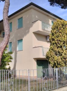 a building with a fence in front of it at Mare Pineta 2 in Lido di Volano