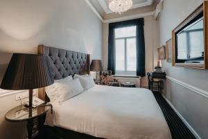 Postel nebo postele na pokoji v ubytování Hotel Manos Premier