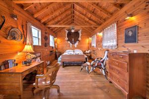 a bedroom with a bed in a wooden cabin at Ark Bunkhouse Fredericksburg Hideaway with Hot Tub in Fredericksburg