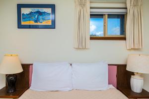 Postel nebo postele na pokoji v ubytování Puffin Condo