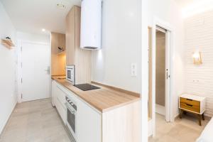 Kuchyňa alebo kuchynka v ubytovaní WintowinRentals Apartamento sostoa 156
