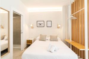 Posteľ alebo postele v izbe v ubytovaní WintowinRentals Apartamento sostoa 156