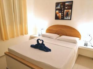 Postel nebo postele na pokoji v ubytování Astillo's Guest Houses