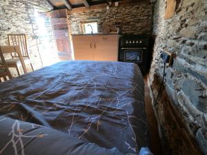 A bed or beds in a room at Bordes Pirineu, Costuix