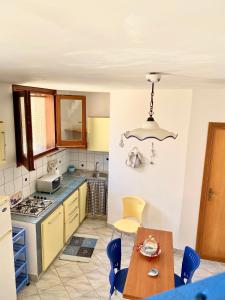 A kitchen or kitchenette at Marettimo Appartamenti