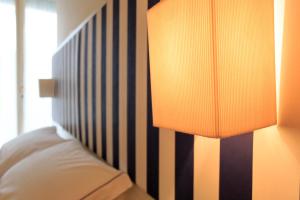 A bed or beds in a room at Mini Hotel