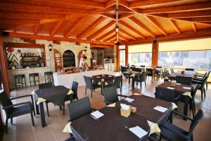 a restaurant with tables and chairs in a room at Charming House in Vieste with Shared Pool and Terrace in Vieste