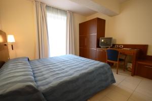 Postel nebo postele na pokoji v ubytování Park Hotel Tyrrenian