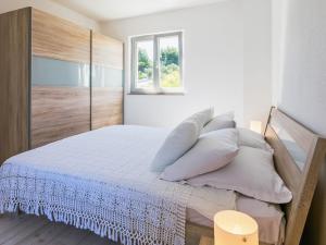 Postel nebo postele na pokoji v ubytování Apartment Villa 2 Pools-4 by Interhome