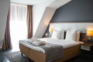 Postel nebo postele na pokoji v ubytování City Hotel Gouda, WorldHotels Crafted Collection + 37 fotografií
