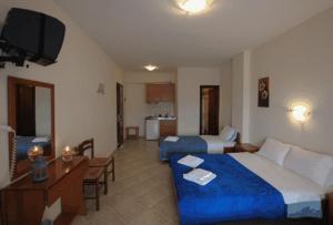 A bed or beds in a room at Panorama Spa Hotel