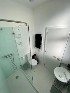 a bathroom with a glass shower and a toilet at Porto.Leça - Studios and Apts (Apt E) in Leça da Palmeira