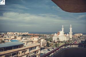 a view of a city with a large building at Panorama Portsaid Hotel in Port Said