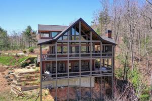 a house on a hill in the woods at The Nest in Blue Ridge