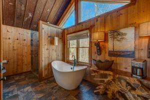 a bathroom with a large tub and a window at The Nest in Blue Ridge +47 photos