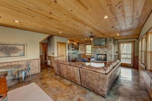a living room with a couch and a table at The Nest in Blue Ridge