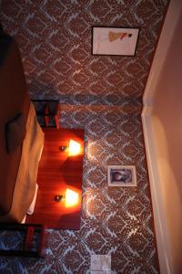 a room with a table and lights on the floor at Hotel Antwerp Billard Palace in Antwerp