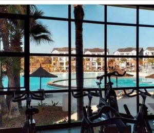 two bikes parked in front of a swimming pool at The blyde Pretoria unit 1244 in Pretoria