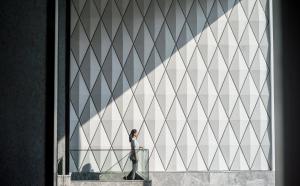 a man standing in front of a building at InterContinental Phuket Resort by IHG in Kamala Beach