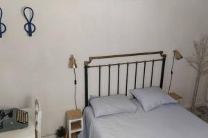 A bed or beds in a room at La musa del Poeta