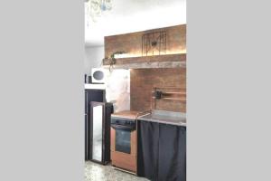 A kitchen or kitchenette at La musa del Poeta
