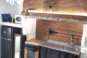 A kitchen or kitchenette at La musa del Poeta
