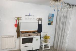 A kitchen or kitchenette at La musa del Poeta