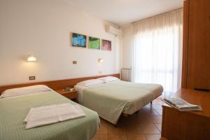 Postel nebo postele na pokoji v ubytování Eco-Hotel Edy
