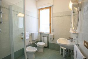 a bathroom with a toilet and a sink at Eco-Hotel Edy in Chianciano Terme