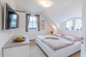 Μια τηλεόραση ή/και κέντρο ψυχαγωγίας στο Haus Kranichsruh Whg_ _StrandGut_