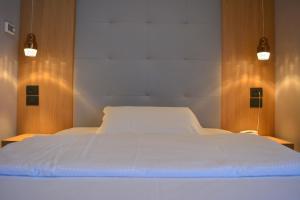 Postel nebo postele na pokoji v ubytování Hotel Virgilio