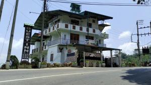 a building on the side of a street at Lucky Star View Inn in Bandarawela