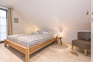 Ένα ή περισσότερα κρεβάτια σε δωμάτιο στο Schulstr_ 15 _Ostseestern_