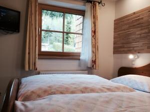 Uma cama ou camas num quarto em Haus Lisa