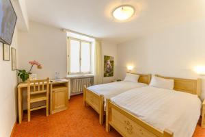 Voodi või voodid majutusasutuse Hotel Centrale, Typically Swiss toas