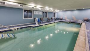 a large swimming pool in a swimming pool at Holiday Inn Express Hotel & Suites Detroit - Farmington Hills, an IHG Hotel in Northville