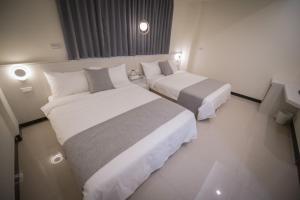 Giường trong phòng chung tại 漫時光 旅空間 ManLu INN