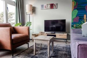 TV a/nebo společenská místnost v ubytování Shell 61