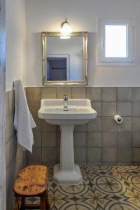 a bathroom with a sink and a mirror at Son Camaro in Ciutadella +21 photos