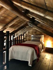 A bed or beds in a room at Cascina Bertolotto Wine Resort