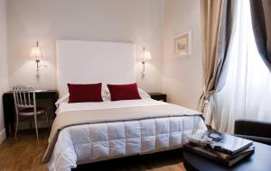 Postel nebo postele na pokoji v ubytování Hotel Clitunno