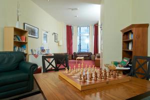 a living room with a chessboard on a table at The Chesterhouse in Douglas